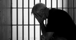older-man-in-jail-cell-aggravated-assault