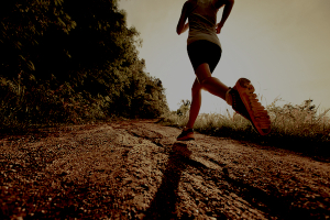 Young lady running on a rural road
