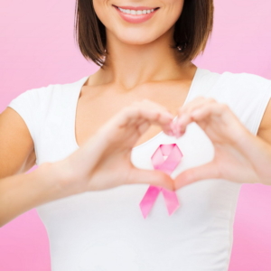 healthcare, medicine and breast cancer concept - woman with pink cancer ribbon